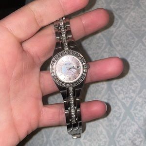 Great condition relic watch. Light pink with diamonds/crystals around the face